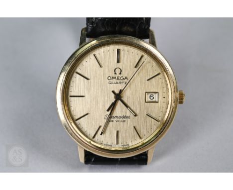 A gentleman's Omega Seamaster, 14k, the quartz movement with gilt dial and baton markers, date aperture at 3, with part lumin