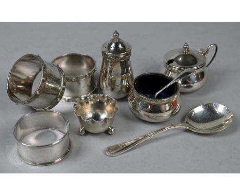 A silver three-piece condiment set with Celtic strapwork rims,&nbsp;Joseph Gloster Ltd., Birmingham 1966, to/w a similar pair