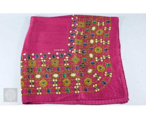 Chanel - A silk scarf in deep pink 'Jewel' design, with rolled edge