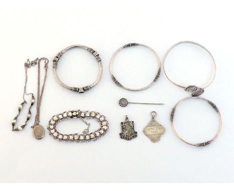 A mixed lot of silver and white metal jewellery, including a locket, stamped 'STERLING SILVER'; a heart link bracelet, fully 