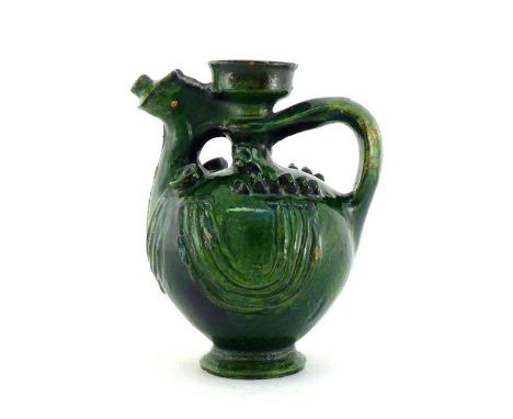 A green glazed ceramic water pot or aquamanile with simple stylised decoration of a bird, with open filler and small spout,  