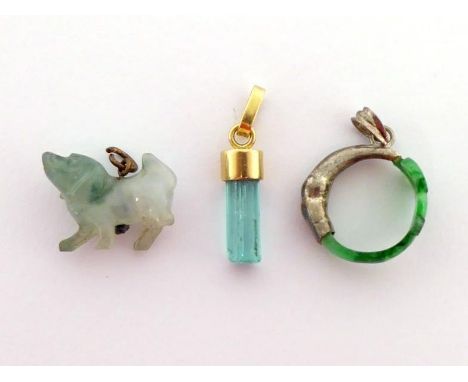 Three green stone pendants, including a rough emerald crystal, the yellow mount stamped '18ct', 2cm long, including bale; and