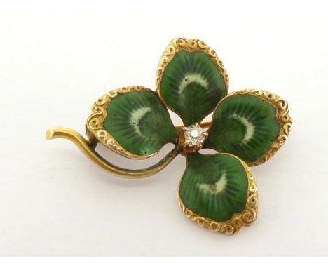 A late 19th century diamond and enamel four leaf clover brooch, the realistically enamelled leaves with a small old brilliant