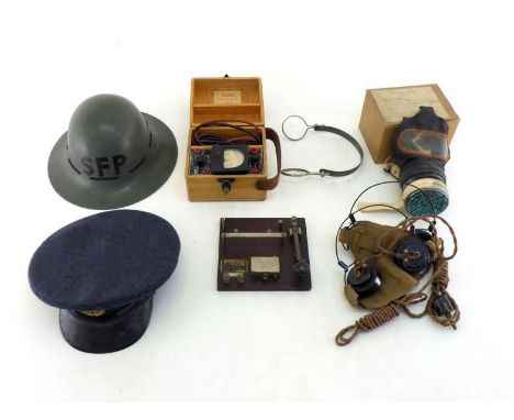 World War II items:- An RAF cap, a Supplementary Fire Party civilian helmet, a gas mask in original box, a Morse code tapper 