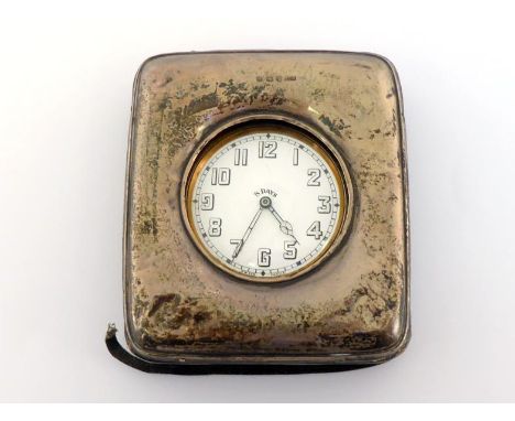 Motoring interest:- a brass eight-day dashboard clock with provision for dashboard mounting and winder at 6 o’clock, the move