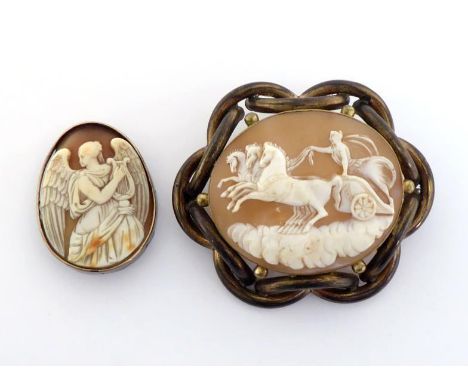 Two late 19th century shell cameos, the first, a large oval  depicting Aurora on her chariot, 5.1 x 4.4cm, mounted in a heavy