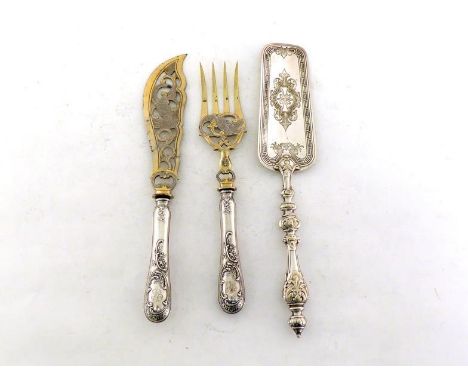 A pair of German silver-handled fish servers with gilt metal blade and tines, circa 1900, handles chased with flowers and scr