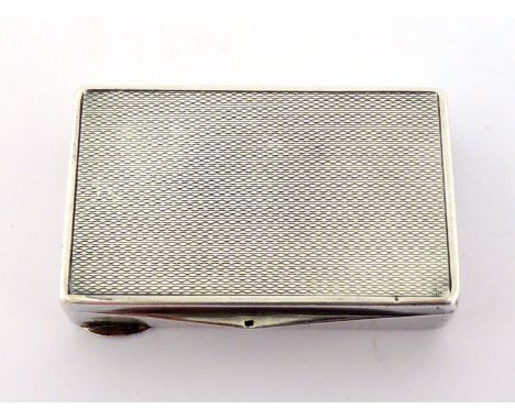 A German silver snuff box, .835 standard, with engine turned finish. CR very slight bruising to lid, slight bump to one corne