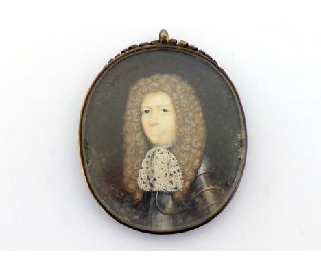 A portrait miniature of a gentleman with voluminous brown wig  and lace neckerchief over armour, circa 1690, the brass frame 