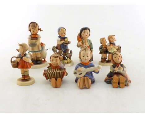 A group of seven Hummel figurines of children. 