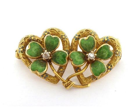 A diamond and enamel double-heart and clover brooch, the two open work hearts with chased and enamelled detail, the enamelled