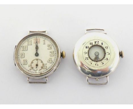 A 1920s silver half hunter wristwatch, the screw back case import marked Edinburgh 1926, the white enamel dial with Arabic sk