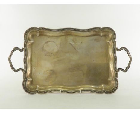 An Italian silver two-handled tray, shaped rectangular with ribbed and moulded edge, .800 standard, Vicenza, post 1968, 46.5 
