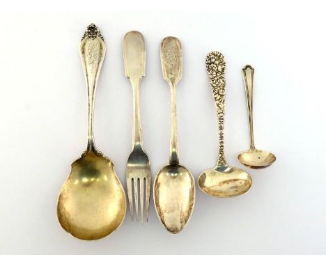 A Russian silver fiddle pattern table spoon, monogrammed, Moscow, 1908/17; a Russian fiddle pattern table fork, St. Petersbur