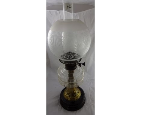 A brass oil lamp with glass reservoir, chimney and shade with opaque decoration, 59cm high