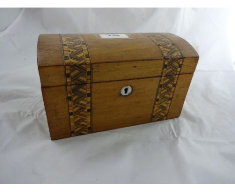A Victorian dome top tea caddy with two division lidded interior, inlay and crossbanding