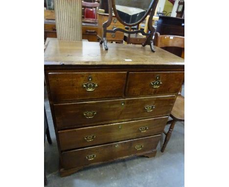 A good oak chest of two short over three graduated long drawers on bracket feet with brass handles and escutheons, 91cm x 48c