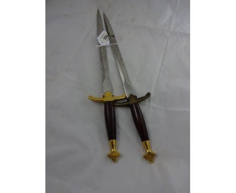 Two Wilkinson daggers, with detail under hilt