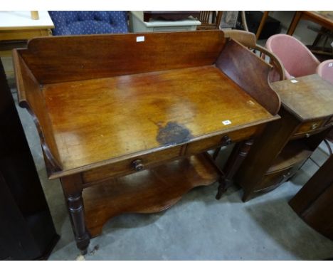 A mahogany washstand with raised gallery back over two drawers and shaped stretcher shelf under on turned legs, 102cm x 51cm 