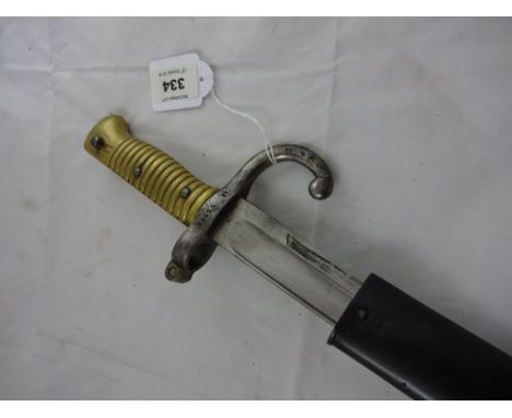 A boyonet stamped AB 55904 in scabbard, 71cm