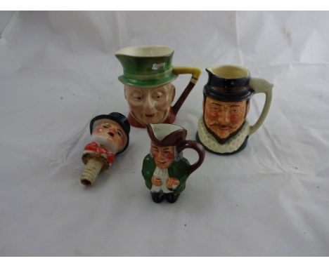 Three miniature toby jugs together with continental ceramic figural bottle top pourer