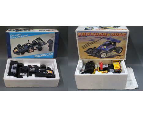 A boxed electronic Sonic controlled racing car and a Nikko America Inc radio control 1/10 scale Thunder Bolt racing car