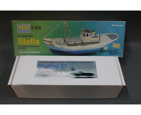 A German Hegi Modellbau B-3515 fishing cutter  "Stella" building set and a Pocket Rockets 1/24 scale model kit of Donald Camp