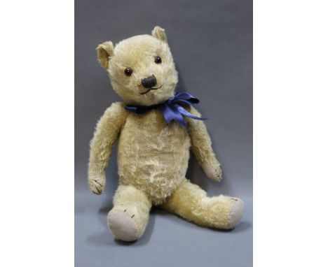 A 1930's Chiltern Hug Me teddy bear, with wood wool filled head, restored pads, and squeaker