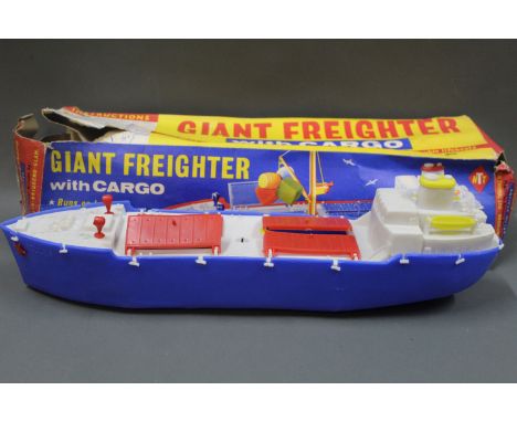 A vintage T N Thomas Ltd plastic model of a giant freighter with cargo in its original illustrated box   