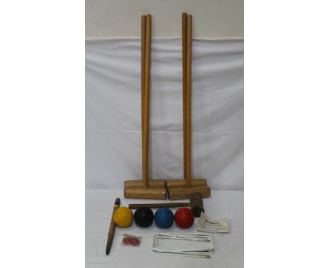 A vintage croquet set with balls 