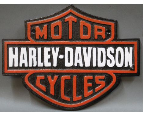 A cast iron reproduction Harley-Davidson Motorcycles sign, in black, red &amp; white 