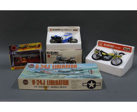 A Matchbox Superkings (K-9) fire tender, an Airfix 'Consolidated B-24 J Liberator' model kit, and two Polistil motor bikes  