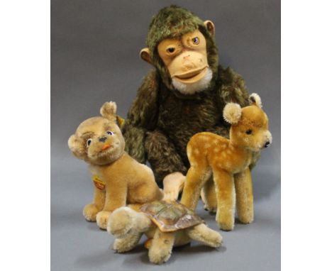 A group of 4 1950s-80s Steiff animals, all with buttons: A "Jocko" monkey (1965-81), a "Fawn", a "Mopsy" dog, and a "Slow" to