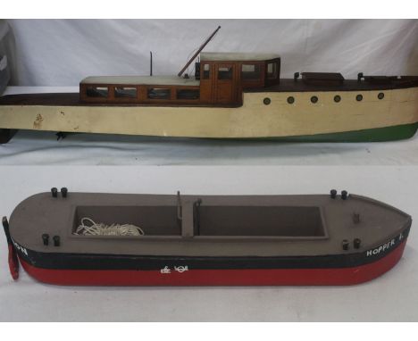 Two wooden model boats, consisting of a green/white painted boat and a Hopper part boat