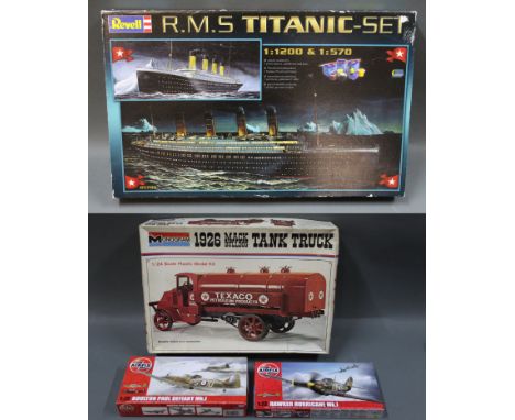 A Revell 1:1200 &amp; 1:570 RMS Titanic model kit, a Monogram 1/24 scale "1926 Mack Bulldog Tank Truck" plastic model kit, an