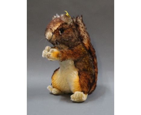A large 1968-78 Steiff "Perri" Squirrel, in very good condition, measuring 22cm tall, and with button &amp; label (2040/22)
