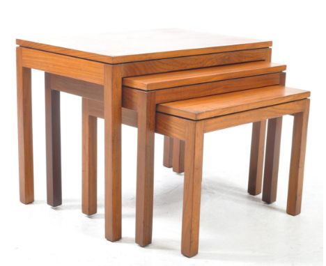 British Modern Design - A vintage 20th century teak wood nest of tables. Each table of rectangular graduating form, raised on