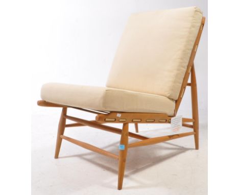 Lucian Ercolani for Ercol Furniture - Ercol model 427 easy chair. Show wood beech frame with webbed seat and back rest with c