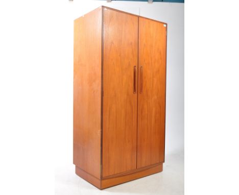 G-Plan - Fresco - A vintage mid 20th century G-Plan Furniture Fresco Range teak double wardrobe. The wardrobe raised on an in