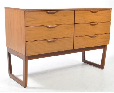 Europa Furniture - A vintage mid 20th century teak veneer chest of drawers sideboard. The chest of drawer raised on shaped su