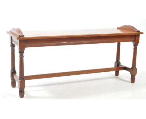 A Victorian 19th century mahogany hall settle / window seat bench. Of Rectangular form being raised on reeded arched friezes 