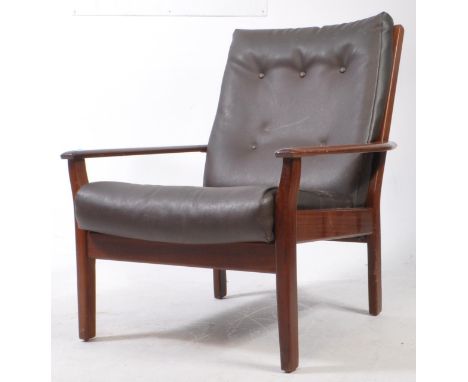 British Modern Design - A retro mid century teak easy armchair. Flat elbow rests on square upright supports with drop in butt