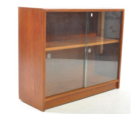 British Modern Design - A retro mid 20th century teak bookcase cabinet. With twin glazed front sliding doors and shelf within