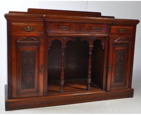 Victorian late 19th century art nouveau style mahogany buffet sideboard. Sideboard raised on a plinth base featuring two cupb