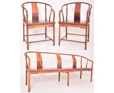 Chinese Huanghuali wood horseshoe salon suite. Comprising a three seater bench and pair of matching horse shoe armchairs. Eac