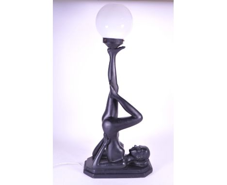 Art Deco style nude female dancer table lamp light. Resin construction with nude lady on her back leg outstretched and globul
