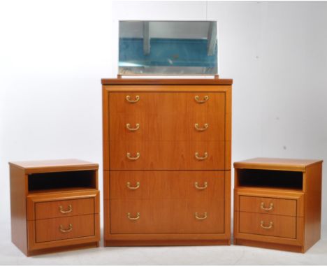 A vintage mid 20th century teak pedestal chest of drawers, alongside matching bedsides and mirror. The chest of drawers raise