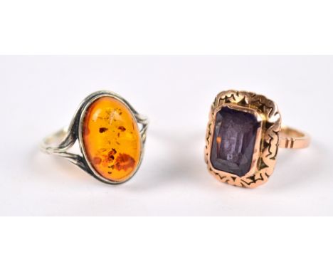 A 14ct rose gold dress ring set with radiant cut amethyst within a decorative border, size K and a sterling silver example se