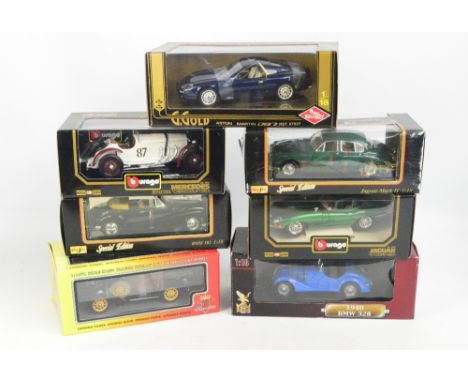 A collection of various boxed diecast toy vehicles including Burago and Maisto in 1:18 scale.