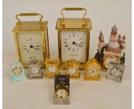 A collection of clocks including a Taylor and Bligh brass carriage clock, the white enamel dial set with Roman numerals and f